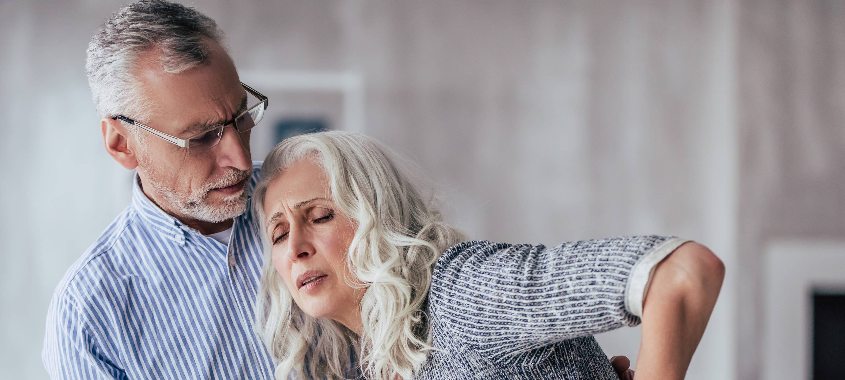 Doctor vaccinating a senior woman.