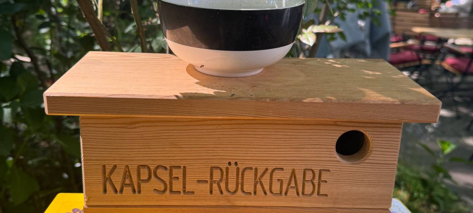 Rückgabebehälter für die leeren Kapseln